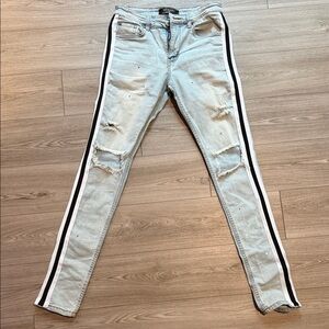 Stylish Light Blue Distressed Jeans with Black Stripes